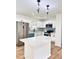 Modern kitchen with white cabinets, stainless steel appliances, and a marble countertop island at 4074 Green Hawk Trl, Decatur, GA 30035