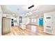 Open-concept living area featuring wood-look flooring, and a modern kitchen at 4074 Green Hawk Trl, Decatur, GA 30035