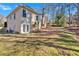 Backyard view features lawn space and landscaping near the home's exterior at 4990 Sawgrass Nw Pl, Acworth, GA 30102