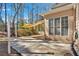 Backyard patio with partial shade canopy and lush trees at 4990 Sawgrass Nw Pl, Acworth, GA 30102