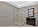 Elegant bathroom with a glass walk-in shower, granite vanity, and neutral tile at 4990 Sawgrass Nw Pl, Acworth, GA 30102