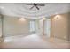 Spacious bedroom featuring tray ceilings, recessed lighting, and natural light at 4990 Sawgrass Nw Pl, Acworth, GA 30102