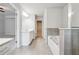Bright bathroom with a double vanity, a soaking tub, and a separate glass-enclosed shower at 791 Belrose Dr, Smyrna, GA 30080