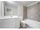 Bathroom featuring a bathtub with tile surround, and a white vanity with countertop and sink at 791 Belrose Dr, Smyrna, GA 30080