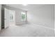Bright bedroom featuring neutral walls, carpet flooring, and a window allowing for natural light at 791 Belrose Dr, Smyrna, GA 30080
