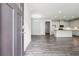 Inviting entryway with hardwood floors that leads to a spacious open-concept kitchen and living area at 791 Belrose Dr, Smyrna, GA 30080
