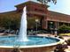 Water fountain in front of a Cheesecake Factory restaurant, surrounded by planters and landscaping at 791 Belrose Dr, Smyrna, GA 30080