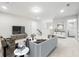 Bright living room featuring modern furniture, neutral decor, and access to a bathroom at 791 Belrose Dr, Smyrna, GA 30080
