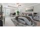 Tranquil primary bedroom with a tray ceiling, a ceiling fan, and ample natural light at 791 Belrose Dr, Smyrna, GA 30080