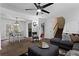 Spacious living room with a dining area, modern lighting, and comfortable seating at 392 Fourth St, Forest Park, GA 30297