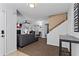 Open-concept living room with modern decor, cozy seating, and a staircase at 392 Fourth St, Forest Park, GA 30297