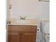Standard bathroom with a wood vanity, light countertop, and a white toilet at 4750 Crinklepoint Ct, Douglasville, GA 30134