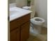 Standard bathroom with a light wood vanity and a white toilet at 4750 Crinklepoint Ct, Douglasville, GA 30134