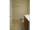 Functional bathroom with a toilet, vanity with sink, and tile flooring, offering convenience and practicality at 4750 Crinklepoint Ct, Douglasville, GA 30134