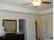 Bedroom with a ceiling fan, dresser, and an open view of the closet at 4750 Crinklepoint Ct, Douglasville, GA 30134