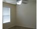 Standard bedroom featuring neutral walls, a ceiling fan, and a window with blinds at 4750 Crinklepoint Ct, Douglasville, GA 30134