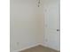 Bedroom featuring a standard door and neutral walls with carpet flooring at 4750 Crinklepoint Ct, Douglasville, GA 30134