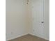 Bedroom featuring a standard door and neutral walls with carpet flooring at 4750 Crinklepoint Ct, Douglasville, GA 30134
