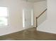 Bright foyer with hardwood floors, white door with sidelights, and staircase to the upper level at 4750 Crinklepoint Ct, Douglasville, GA 30134