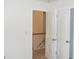 Hallway featuring a closet with a standard door and an open view of the stairway at 4750 Crinklepoint Ct, Douglasville, GA 30134