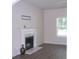 Cozy living room featuring a classic fireplace with marble accents and modern gray flooring at 4750 Crinklepoint Ct, Douglasville, GA 30134