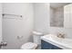 Half bathroom with a modern vanity, updated fixtures, and a stylish mirror with decorative tile at 6565 Bussell Way, Riverdale, GA 30274