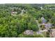 Aerial view of a neighborhood with mature trees and well-maintained homes at 2525 Millwater Xing, Dacula, GA 30019