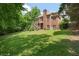 Well-kept backyard with a stairway leading to a second-story deck at 2525 Millwater Xing, Dacula, GA 30019