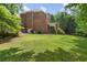 Large backyard with lush green grass, ideal for outdoor activities and relaxation at 2525 Millwater Xing, Dacula, GA 30019