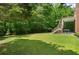 Spacious backyard with a grill on the patio, perfect for entertaining at 2525 Millwater Xing, Dacula, GA 30019