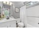 Bathroom featuring a white vanity, shower/tub combo, and light grey walls at 2525 Millwater Xing, Dacula, GA 30019