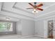 Bedroom with trey ceilings, ceiling fan, and natural light from a window at 2525 Millwater Xing, Dacula, GA 30019