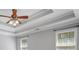 Bedroom with a ceiling fan and beautiful trey ceiling design and natural light at 2525 Millwater Xing, Dacula, GA 30019