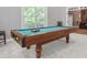 Spacious game room with a billiard table and natural light at 2525 Millwater Xing, Dacula, GA 30019