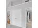 View of the upstairs hall and bedrooms showing a double door entry, carpet, gray walls and white doors at 2525 Millwater Xing, Dacula, GA 30019