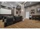 Comfortable home theater room with plush seating and a large projection screen at 2525 Millwater Xing, Dacula, GA 30019