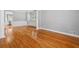 A bright and airy living room featuring hardwood floors, and white trim at 2525 Millwater Xing, Dacula, GA 30019