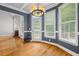 Cozy living room with fireplace, chandelier, hardwood floors, and plenty of natural light at 2525 Millwater Xing, Dacula, GA 30019