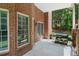 Brick patio featuring an outdoor grill, with a shaded area perfect for entertaining at 2525 Millwater Xing, Dacula, GA 30019