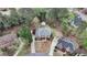 Aerial view of a brick home with a landscaped yard and mature trees at 340 Old York Rd, Johns Creek, GA 30097