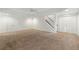 Large finished basement with wall to wall carpeting, recessed lighting and multiple doors at 340 Old York Rd, Johns Creek, GA 30097