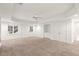 Spacious carpeted basement with natural light coming in from the backyard through a glass door at 340 Old York Rd, Johns Creek, GA 30097