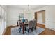 Dining room features elegant chandelier, large window, and access to other rooms at 340 Old York Rd, Johns Creek, GA 30097