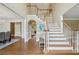 Spacious foyer with hardwood floors, staircase, and views to other rooms at 340 Old York Rd, Johns Creek, GA 30097