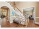 Spacious foyer features hardwood floors, staircase, and bench seating at 340 Old York Rd, Johns Creek, GA 30097