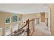 Second floor hallway overlooking the living room, showcasing the open floor plan and natural light at 340 Old York Rd, Johns Creek, GA 30097