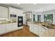 Spacious kitchen with white cabinetry, granite counters, stainless steel appliances, and an adjacent breakfast area at 340 Old York Rd, Johns Creek, GA 30097