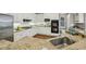 Kitchen features granite countertops, white cabinets, stainless steel appliances, and an undermount sink at 340 Old York Rd, Johns Creek, GA 30097