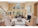 Bright living room features a fireplace, large windows, and high ceilings at 340 Old York Rd, Johns Creek, GA 30097
