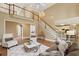 Open-concept living room with high ceilings, access to other rooms, and lots of light at 340 Old York Rd, Johns Creek, GA 30097